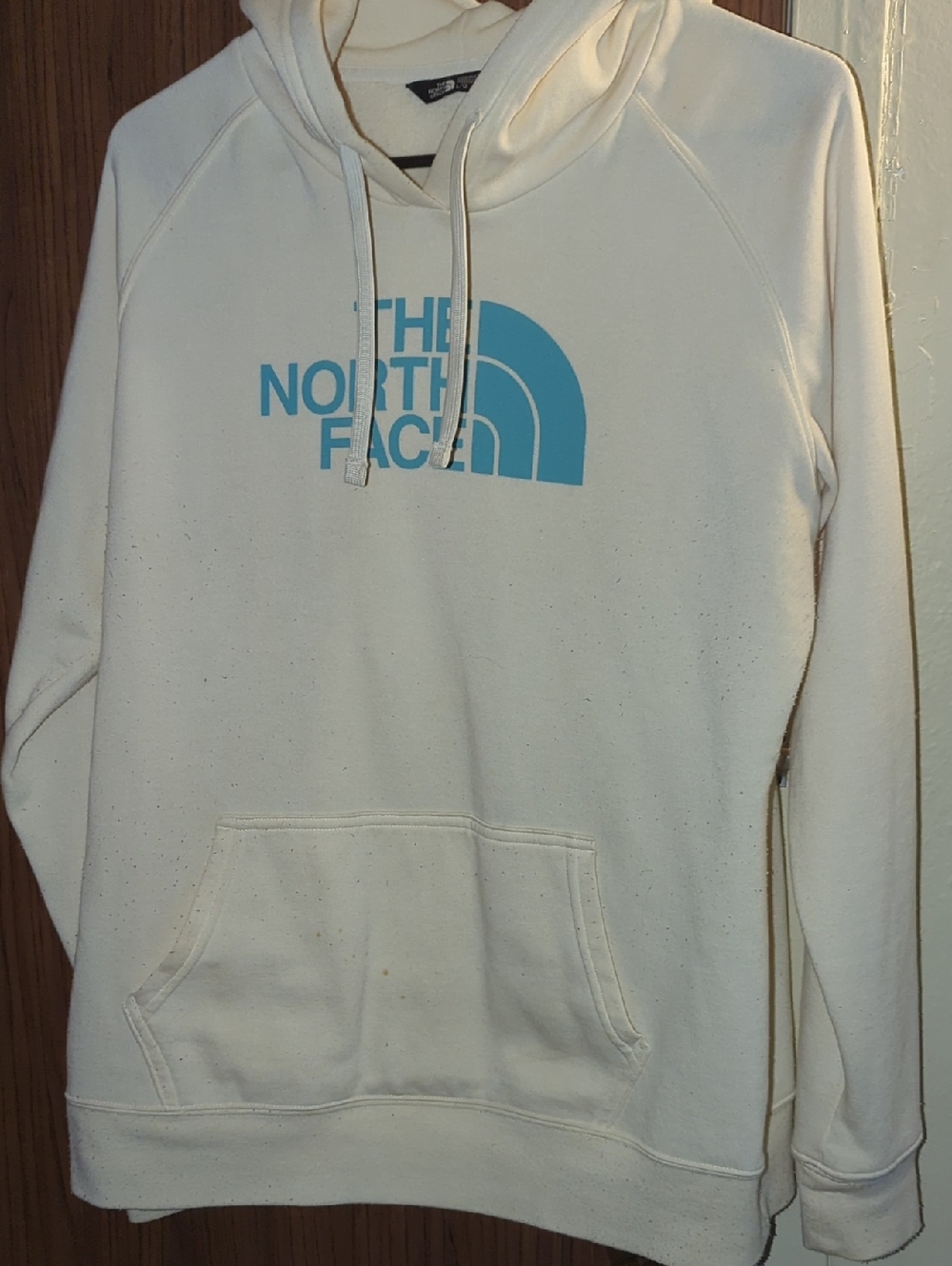 The North Face Woman's Cream Crewneck Hoodie with Blue Logo